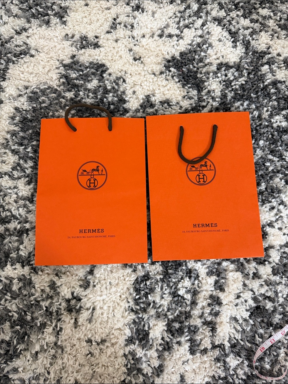 Hermès Orange Shopping Bags with Black Logo and Handles